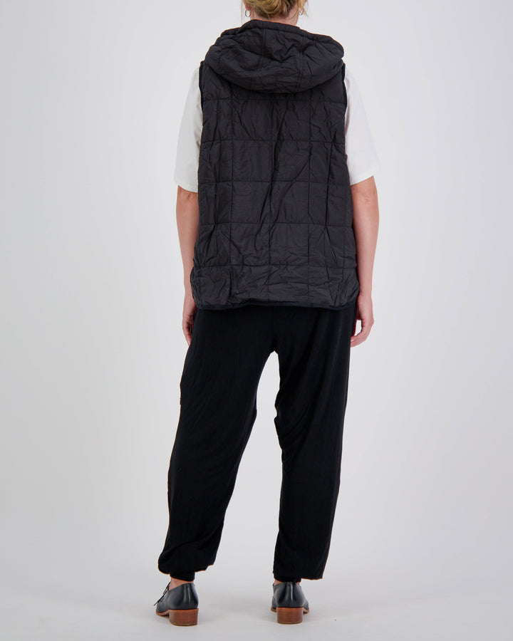 Black adaptive puffer vest by Christina Stephens designed for wheelchair users, featuring a gender-neutral style and universal fit.