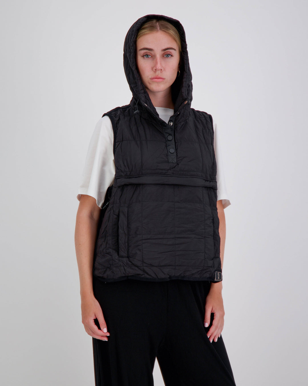 Black adaptive puffer vest by Christina Stephens designed for wheelchair users, featuring a gender-neutral style and universal fit.