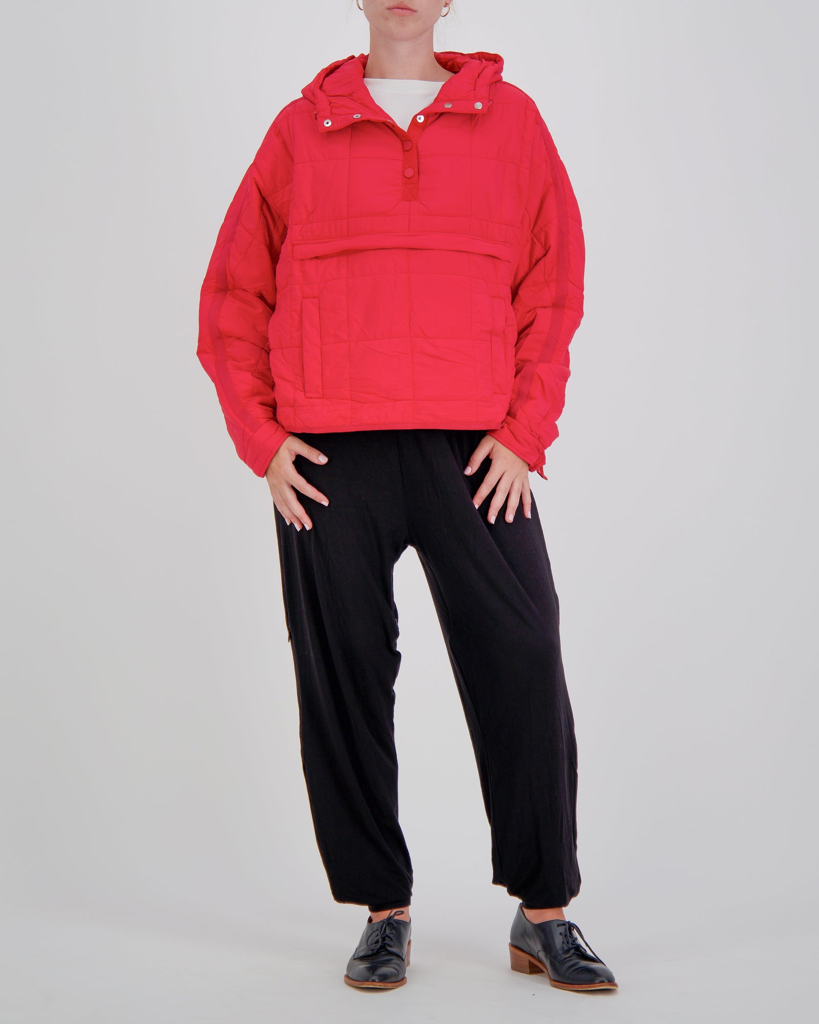 Red Christina Stephens Elly Universal Adaptive Puffer Jacket designed for wheelchair users, showcasing its stylish and functional design.