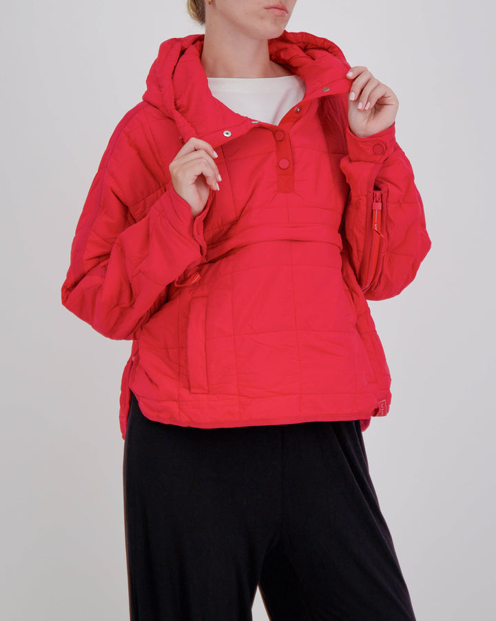Red adaptive puffer jacket by Christina Stephens designed for wheelchair users, featuring a comfortable and stylish fit.
