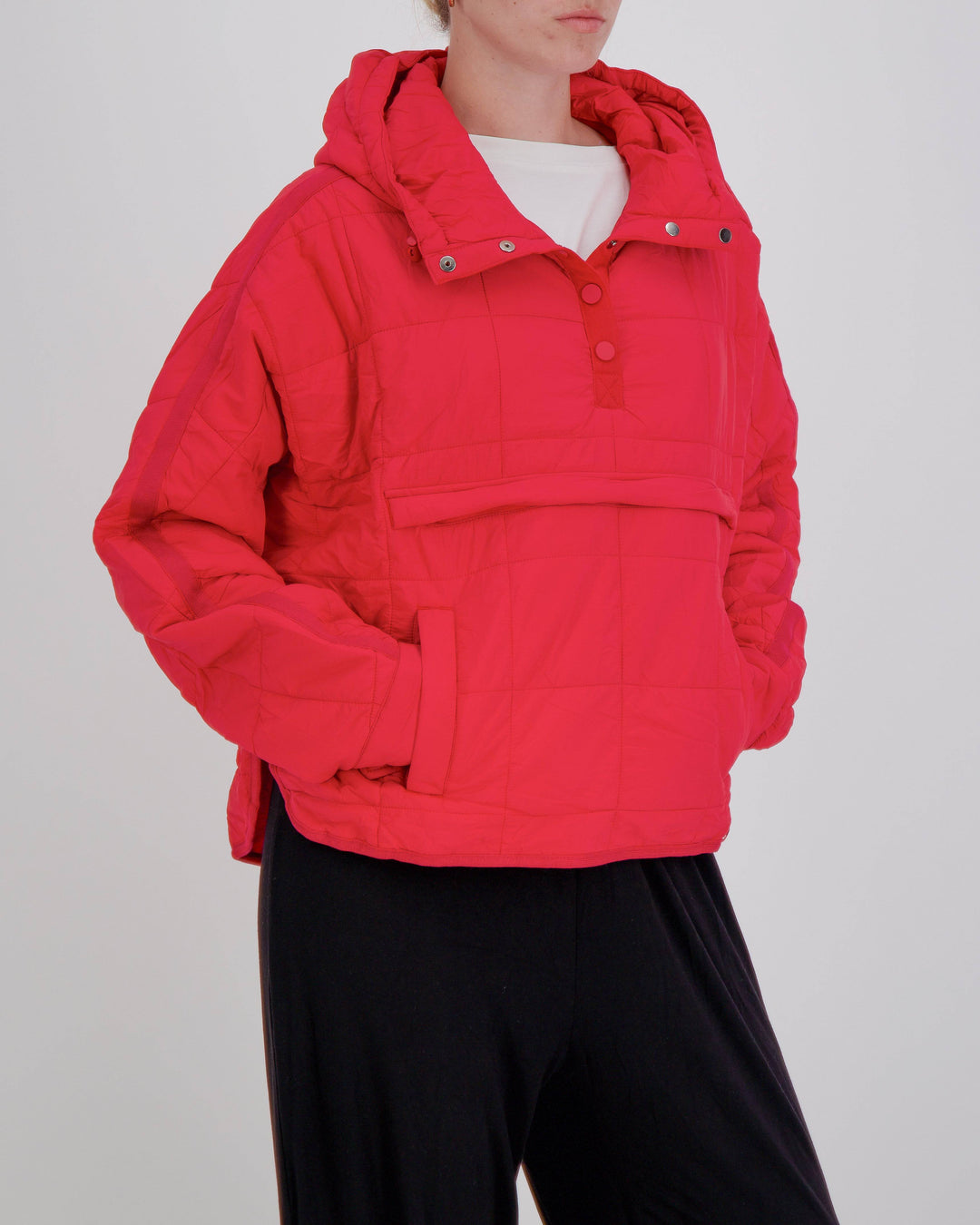 Red Elly Universal Adaptive Puffer Jacket by Christina Stephens designed for wheelchair users, showcasing adaptive features.