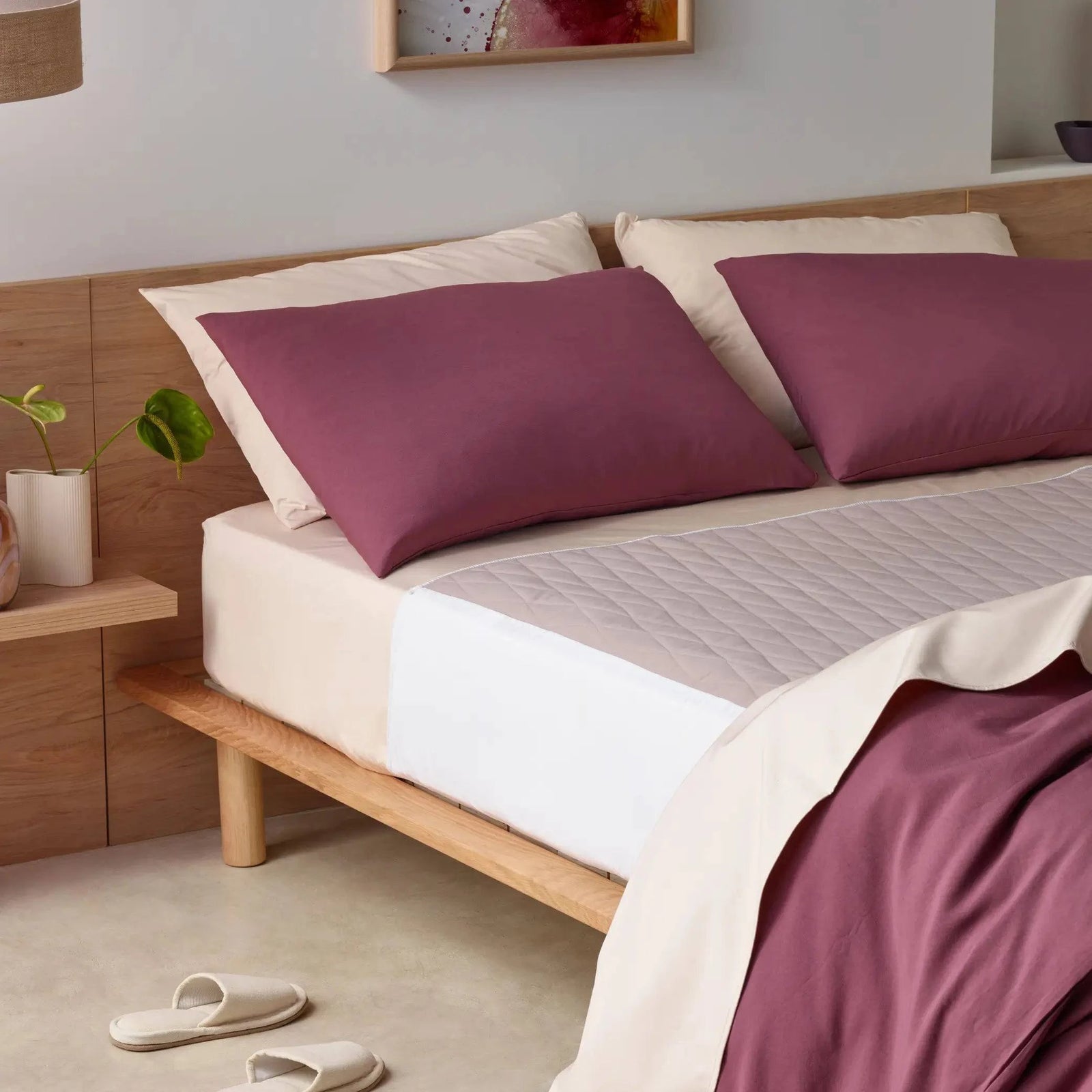 Elegant incontinence-friendly bedding set with a quilted waterproof mattress protector for ultimate comfort and protection. Featuring breathable sheets in a soft beige tone with deep cacao-coloured pillowcases and duvet cover. Hypoallergenic, machine-washable, and discreetly designed for all-night dryness, this stylish bedding set offers a luxurious yet functional sleep solution.