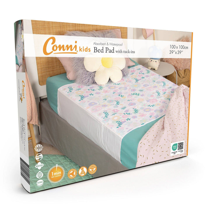 Conni kids bed pad with tuck-ins in a colorful flower print, made of soft Manchester fabric, designed for children&