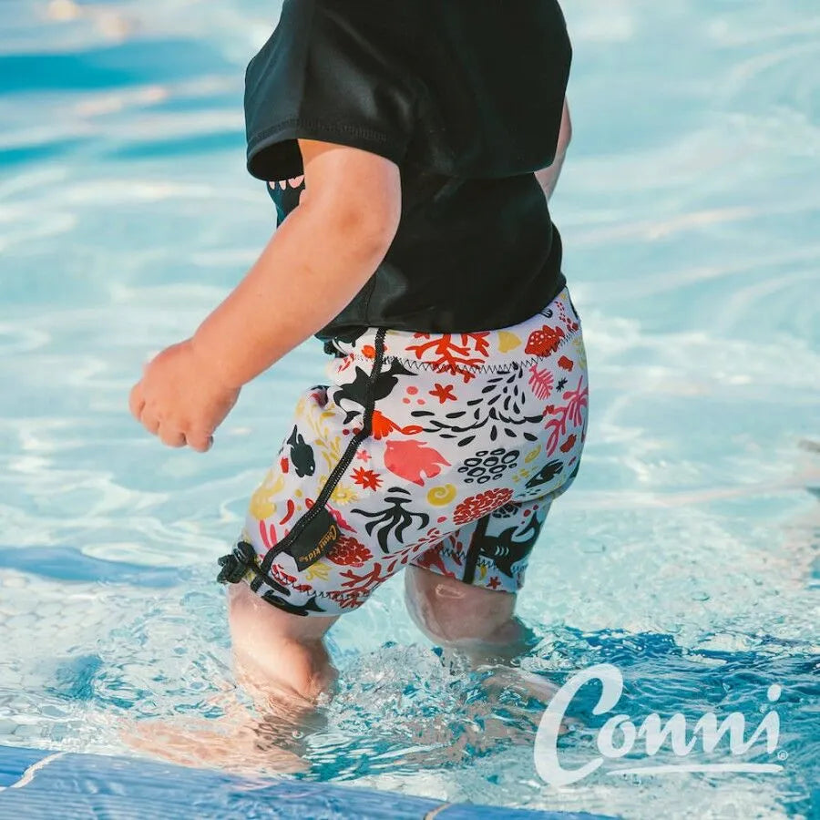 Conni Kids Containment Swim Short in sand castle print, featuring a comfortable fit for active swimming.