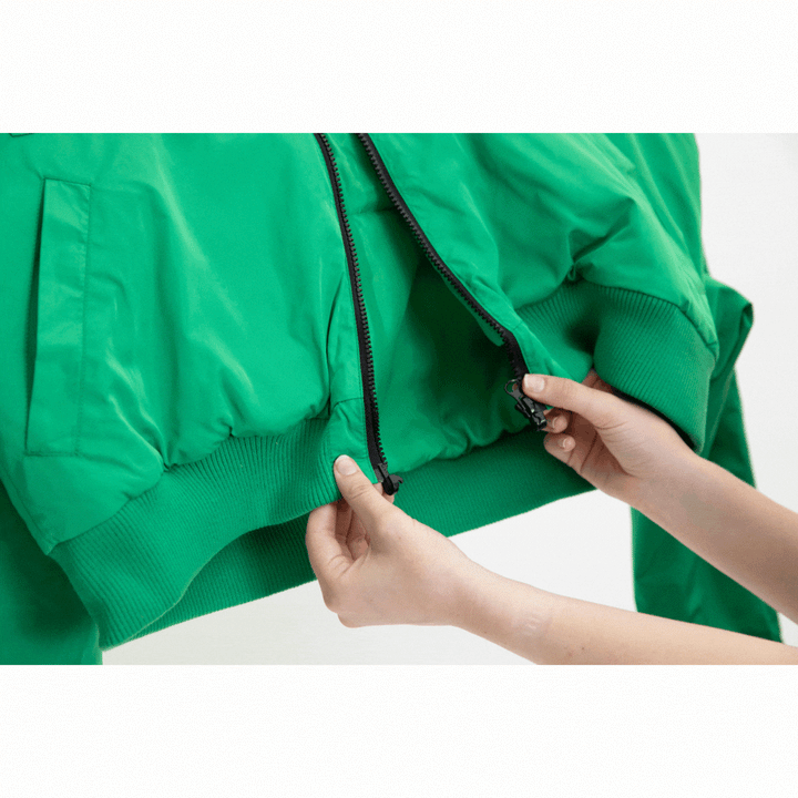 JAM the Label Magnetic Zip Bomber Jacket in black with a stylish design and zipper detail, worn by a model.