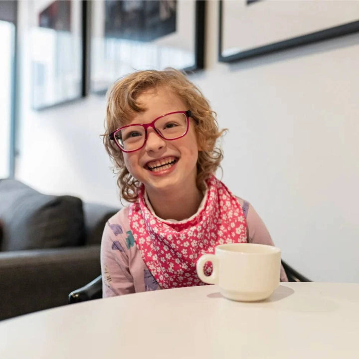 Child wearing Incare Supports Brolly Cotton Bandana, adaptive clothing accessory featuring soft, breathable cotton fabric.
