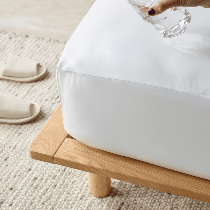 Staydry Duratherme waterproof mattress protector on a bed, showing quilted fabric and secure fitted edges for mattress protection.