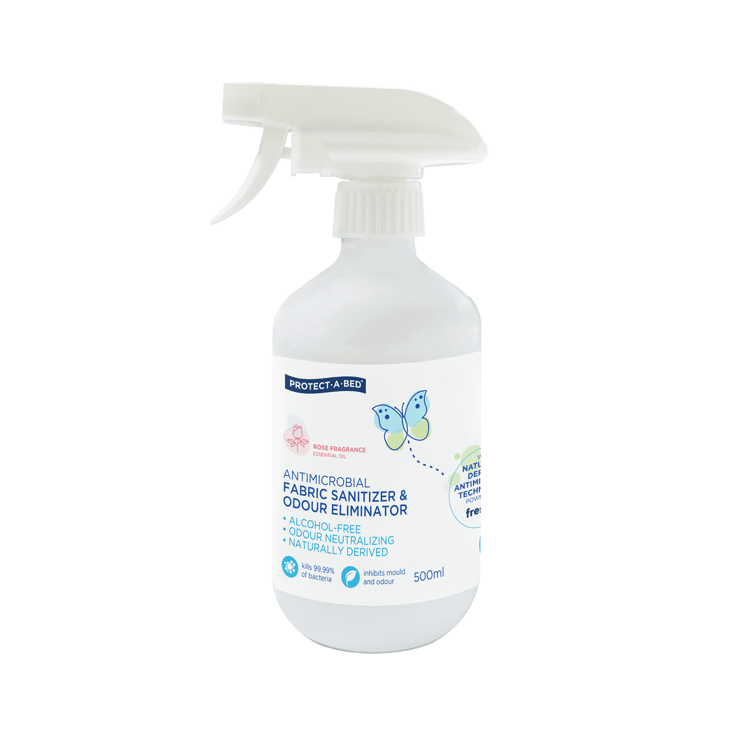 Protect-A-Bed Manchester antimicrobial fabric sanitizer and odor eliminator in rose scent, 500ml bottle, for bedding and fabrics.