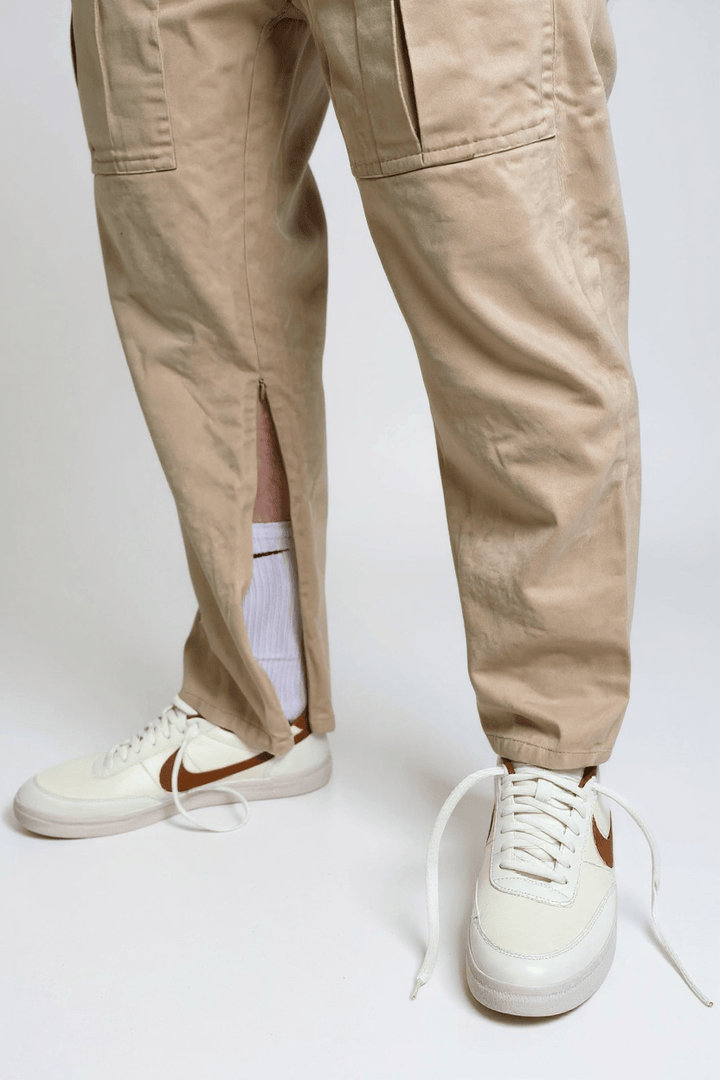 Side access cargo pants by JAM the Label in a stylish design, featuring multiple pockets and a relaxed fit.
