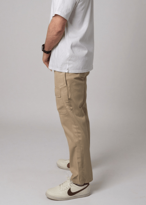 Side view of JAM the Label cargo pants featuring side access pockets and a relaxed fit in a neutral color.