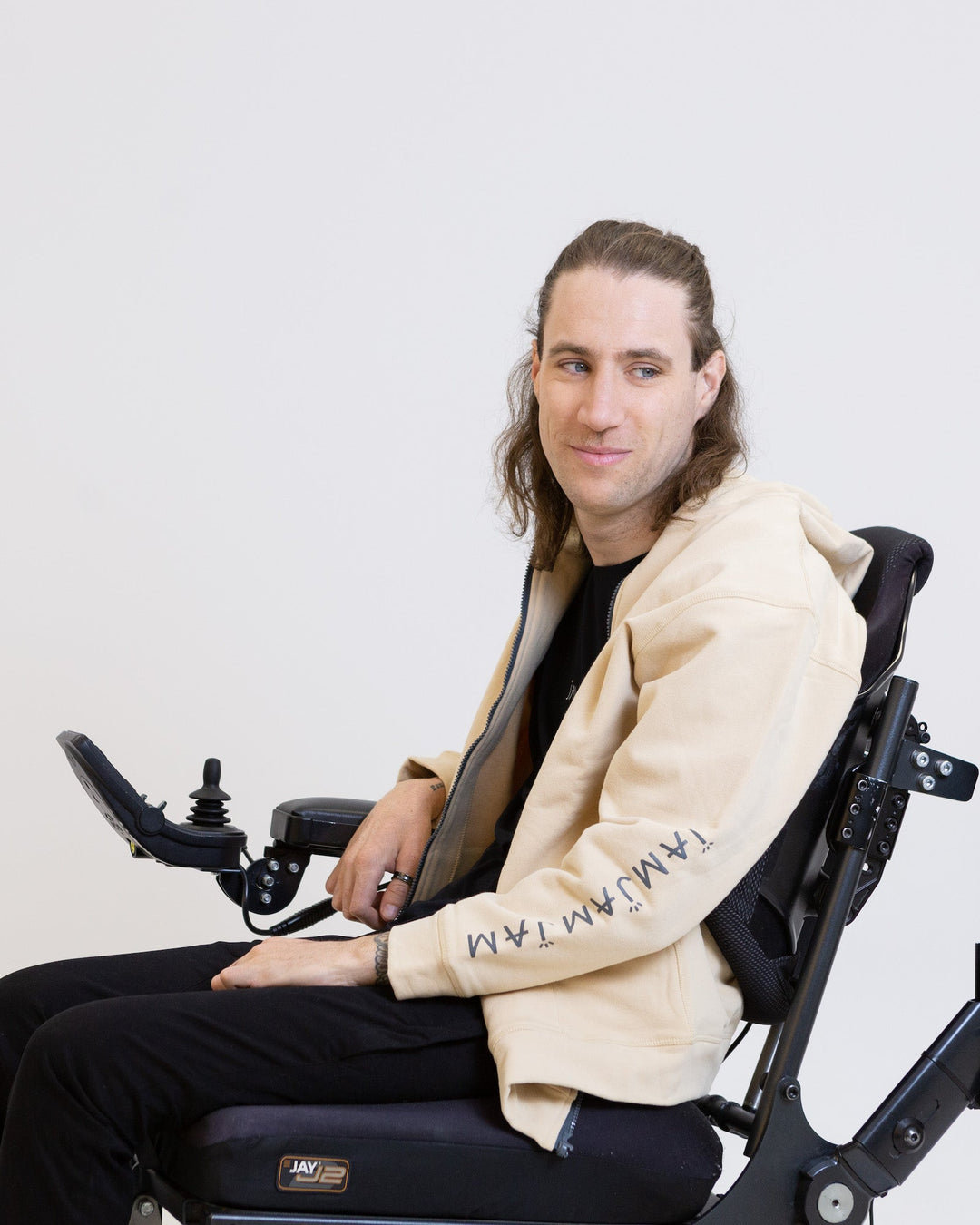 Magnetic hoodie by JAM the Label featuring a relaxed fit and unique magnetic closure design in a casual setting.