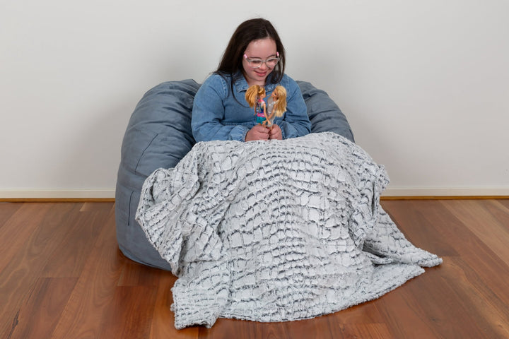 Small KloudSac for kids in vibrant colors, featuring a soft, durable design perfect for playtime and relaxation.