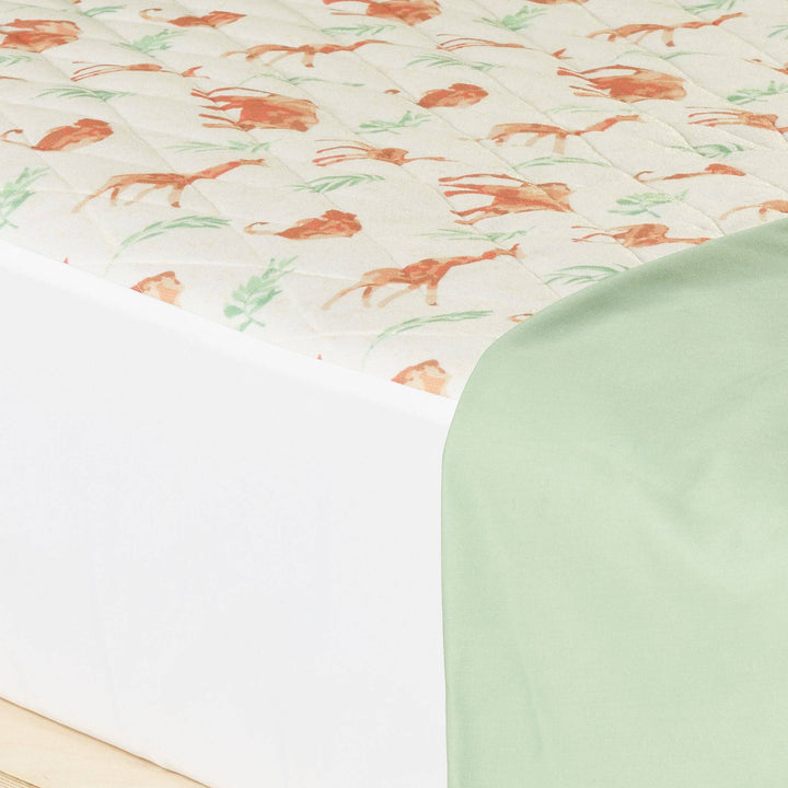 Staydry Little Boss kids bed pad in safari adventure print, waterproof Manchester protector for children's bedding.