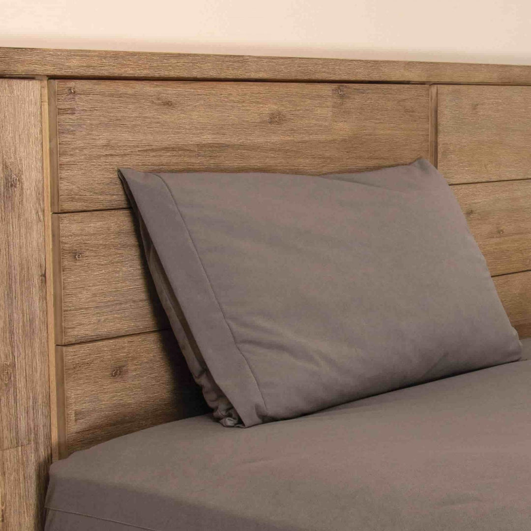 Conni Micro-Plush pillow protector in charcoal, Manchester style, featuring soft, breathable fabric for added comfort and protection.