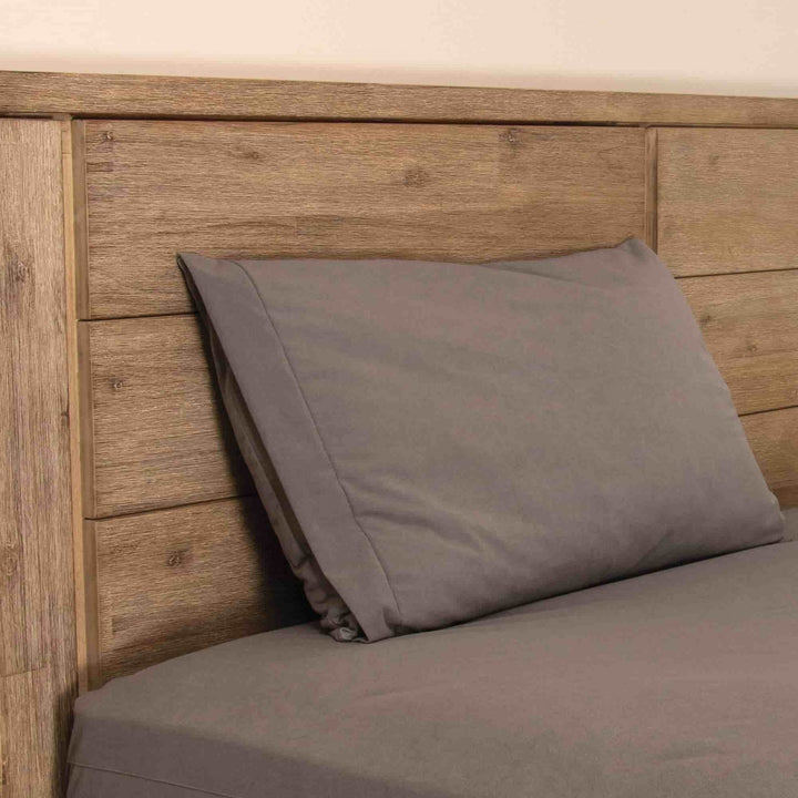 Conni Micro-Plush pillow protector in charcoal, Manchester style, featuring soft, breathable fabric for added comfort and protection.