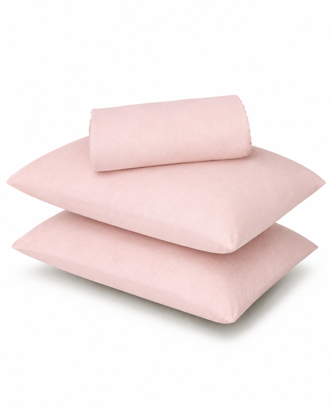 Three light pink pillowcases stacked on a white background, with a matching rolled fabric piece resting on top.