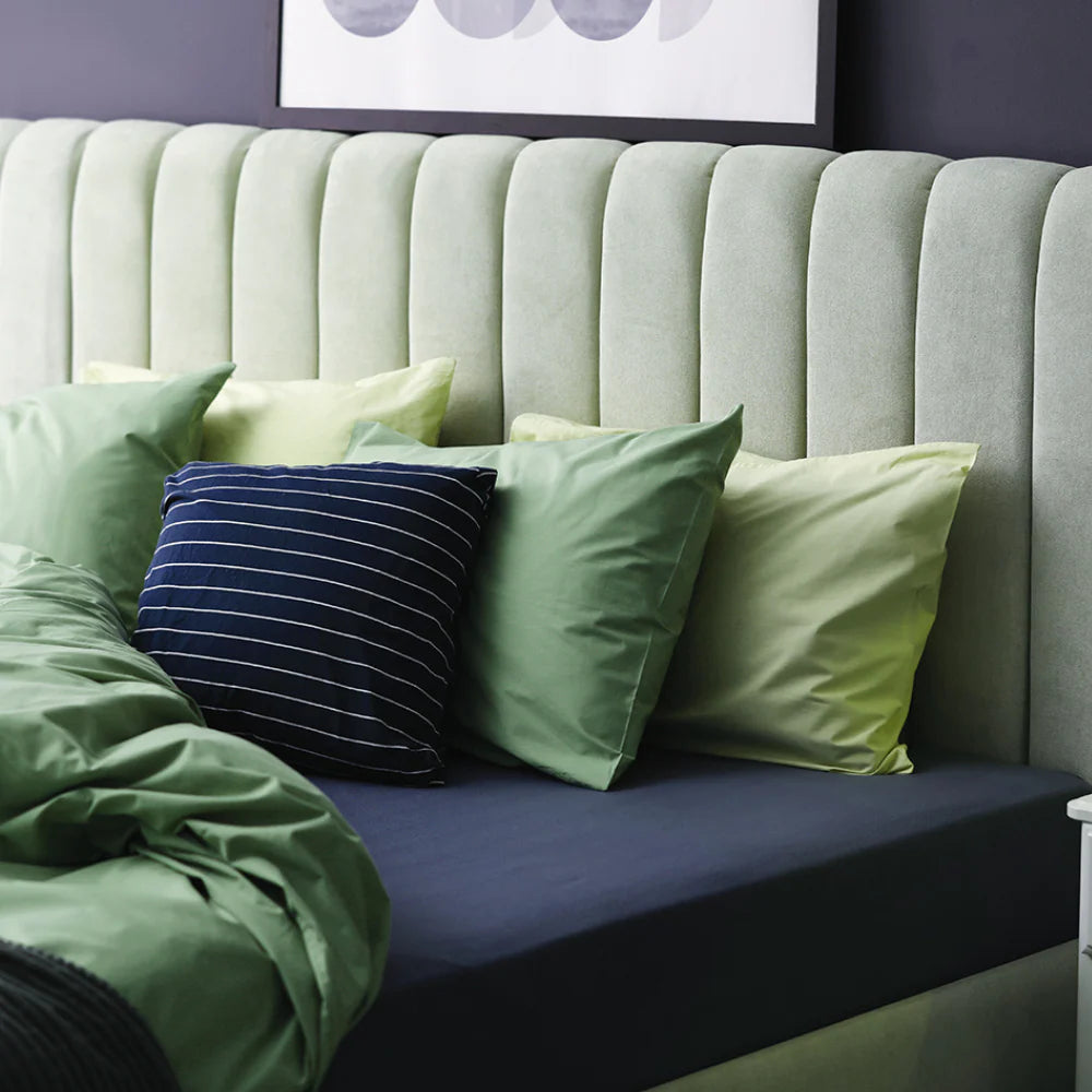 Navy waterproof cotton fitted sheet by Brolly Sheets, designed for Manchester beds, showcasing soft fabric and snug fit.