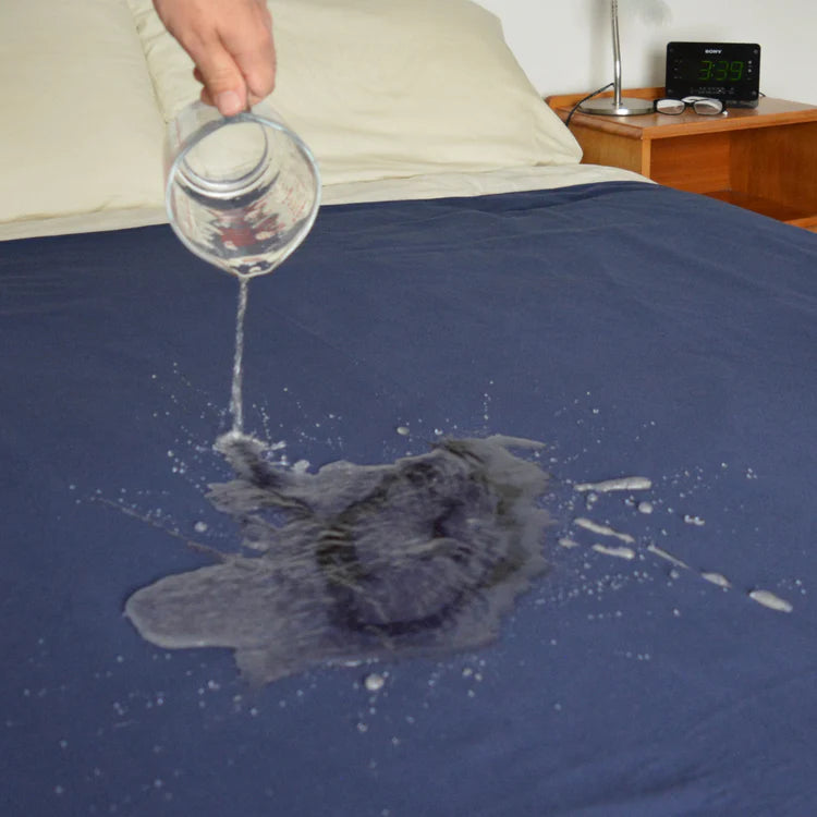 Waterproof navy cotton fitted sheet by Brolly Sheets, showcasing its texture and water-resistant feature.