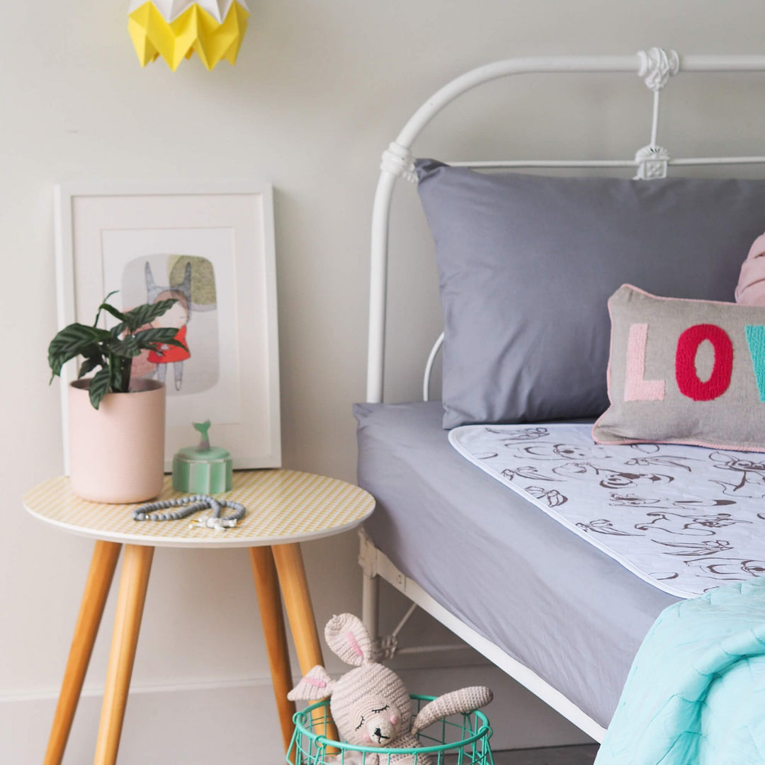 Conni Kids Bed Pad featuring Aussie Animals design, soft fabric, ideal for children's bedding protection.
