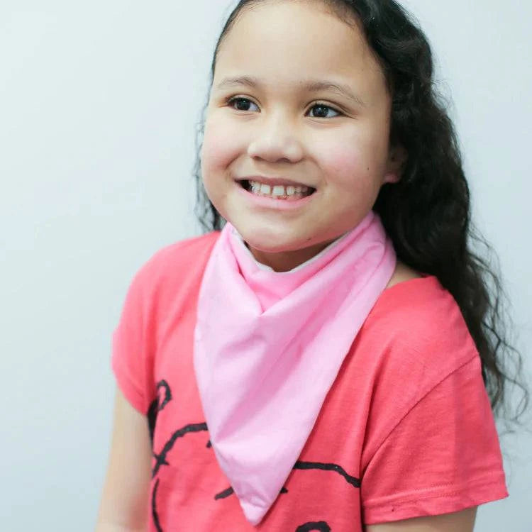 Pink Brolly Cotton Bandana for children, soft adaptive clothing by Incare Supports, shown folded with a colorful pattern.
