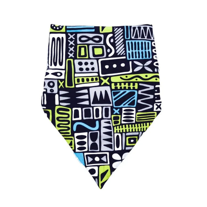 Child wearing a colorful Brolly Cotton Bandana by Incare Supports, a soft and adjustable adaptive clothing accessory.