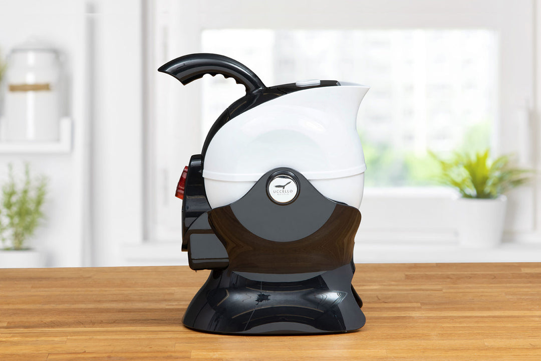 Black and white Uccello kettle from Instacare Shop, side view showing modern electric kettle with sleek design.