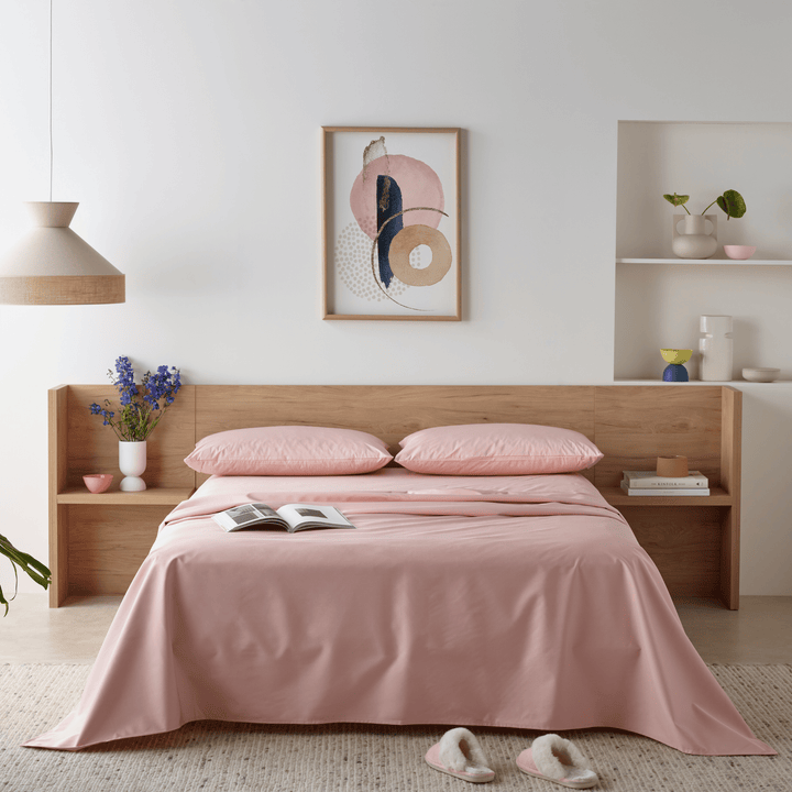 Staydry waterproof bamboo fitted sheet on a bed, blush-colored, made by Stay Dry Products, featuring a soft, moisture-proof fabric.