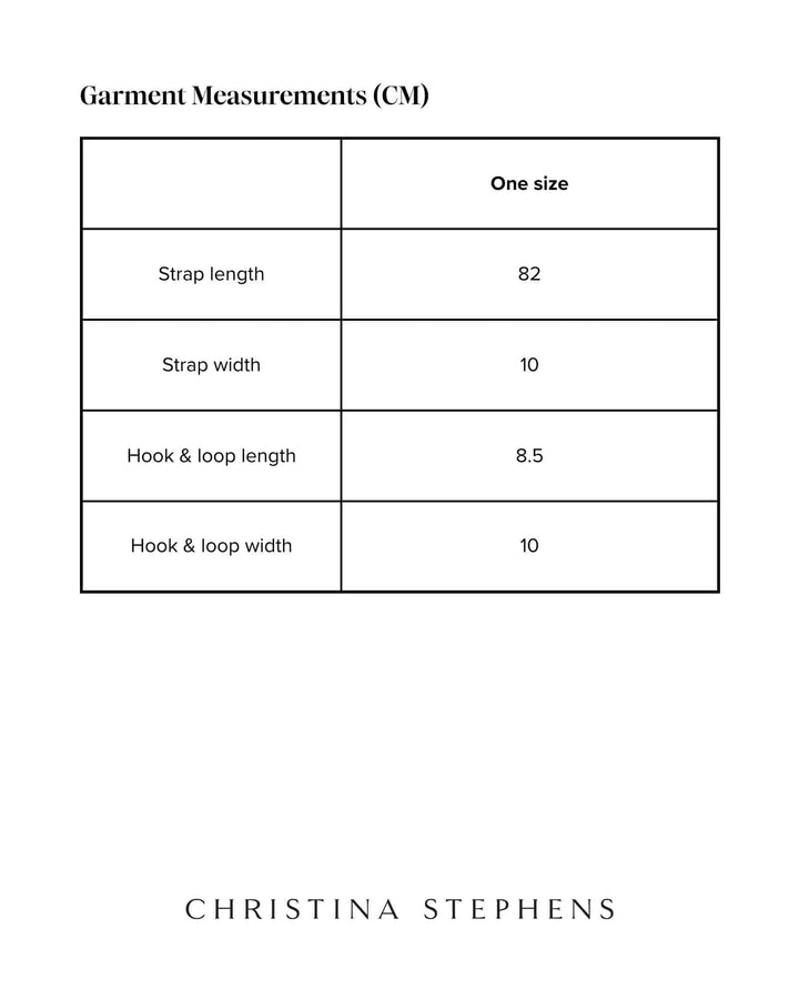 Christina Stephens adaptive wheelchair leg straps accessory showing adjustable straps securing legs for wheelchair users