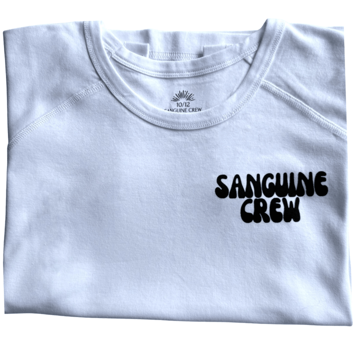 White folded Sanguine Crew T-shirt for kids, showcasing soft fabric and a classic crew neck design.