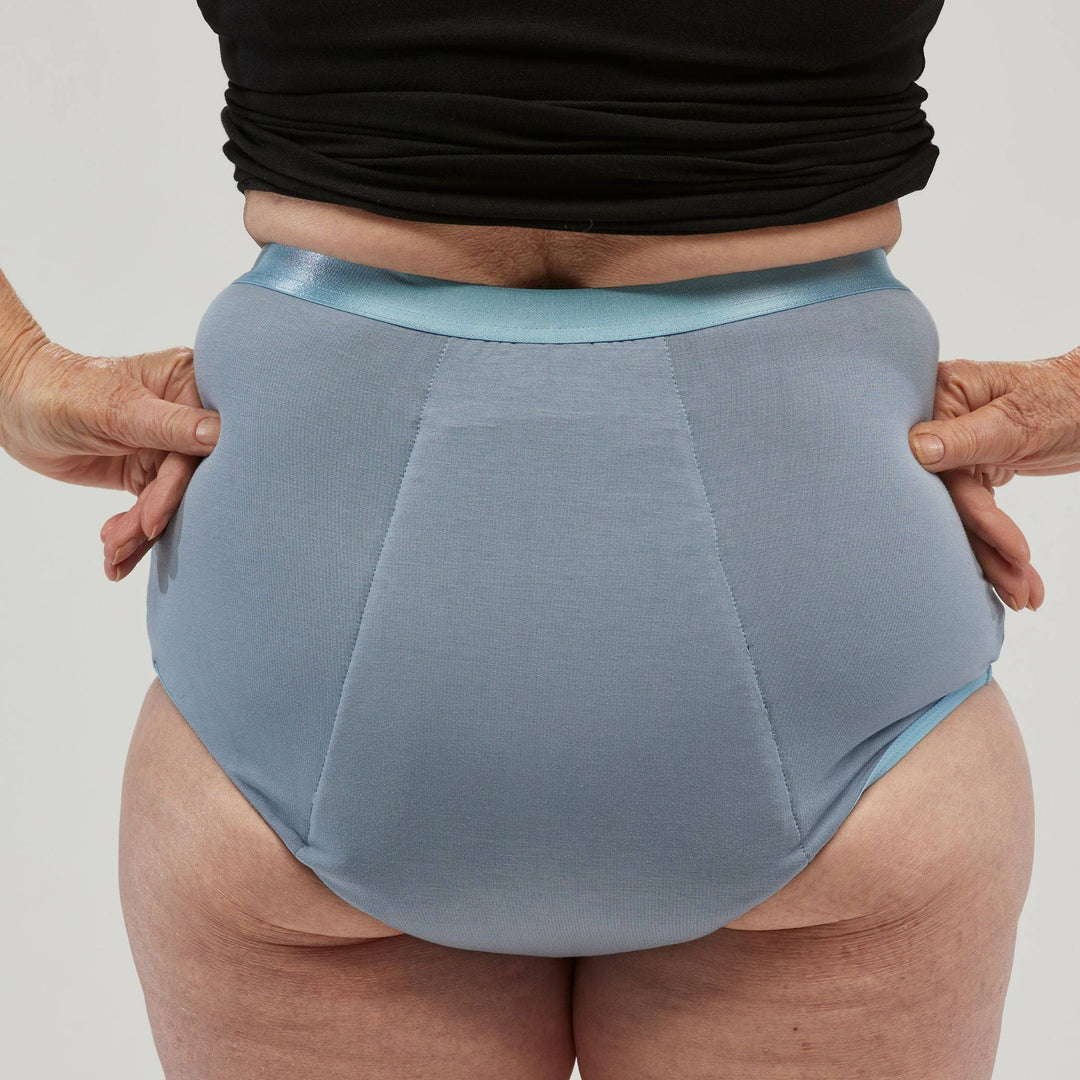Staydry women's full brief in blue, showcasing the back view of the comfortable continence underwear.