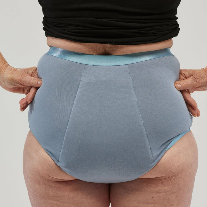 Staydry women's full brief in blue, showcasing the back view of the comfortable continence underwear.
