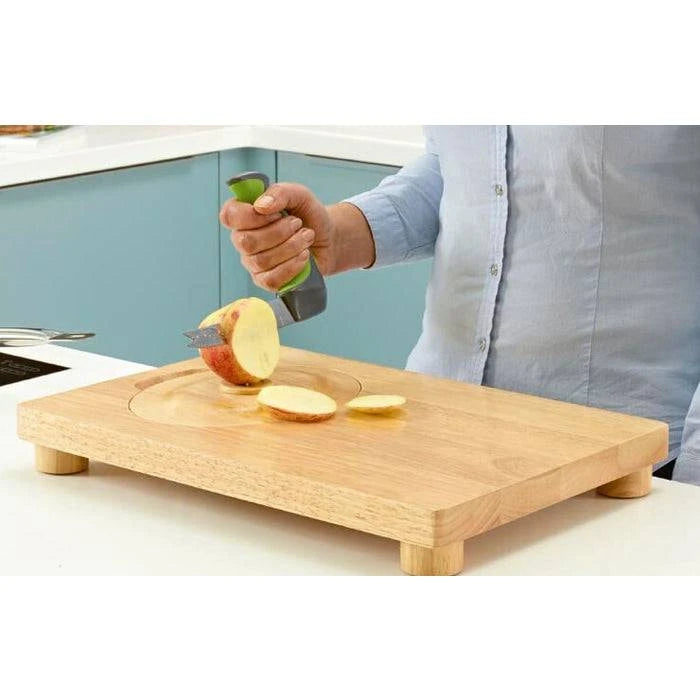 Performance Health multi-purpose food preparation board with sliced vegetables on a clean, sturdy cutting surface.