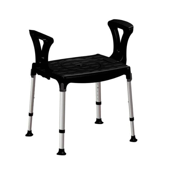 Performance Health King Commode over toilet with armrests, featuring a sleek black design and closed lid.