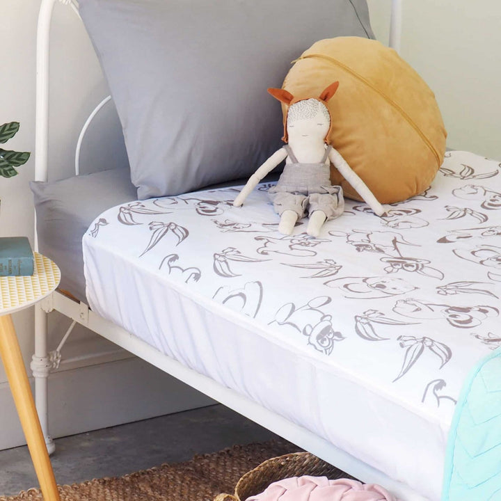Conni Kids Bed Pad with Tuck-ins featuring Aussie Animals design, soft fabric, and secure tuck-in edges for comfort.