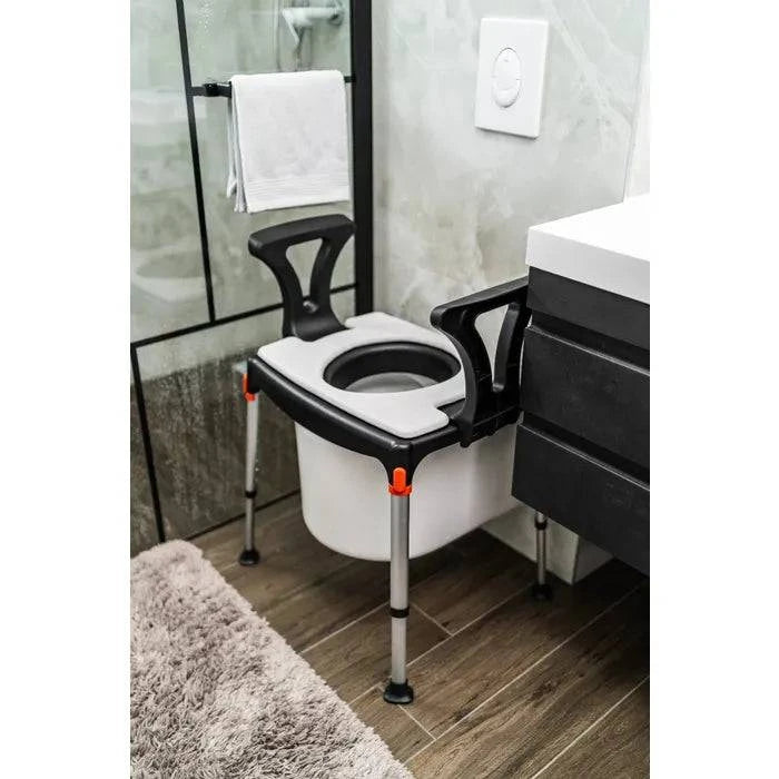 Performance Health King Commode over toilet with armrests, featuring a sturdy frame and comfortable seat for mobility assistance.