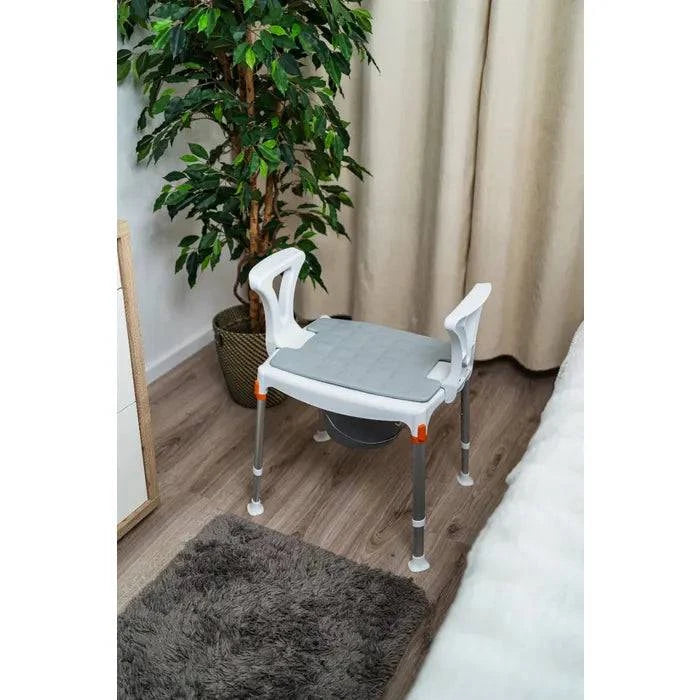 Performance Health King Commode over toilet with armrests, featuring a sturdy frame and comfortable seating for mobility support.