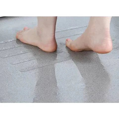 Set of five transparent GripGuard 30 anti-slip strips for bathroom stairs, bathtub, and shower floors for safety.