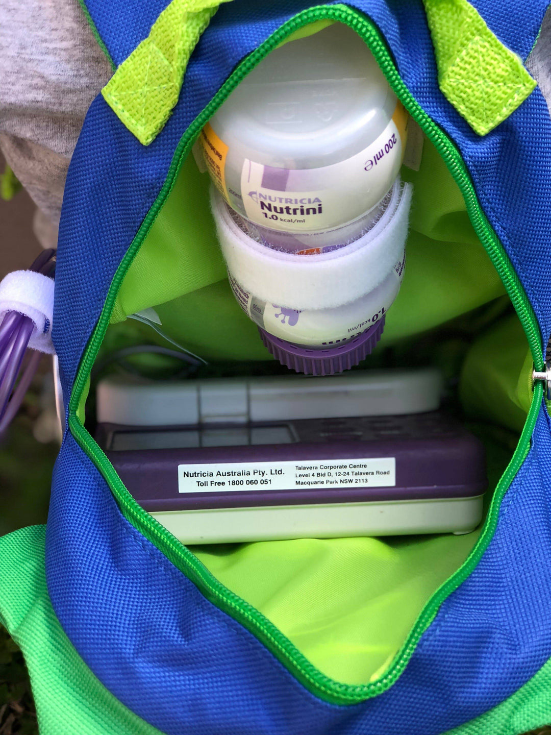Small Tubie Fun backpack designed for nutrition, featuring colorful, child-friendly design with adjustable straps and multiple compartments.