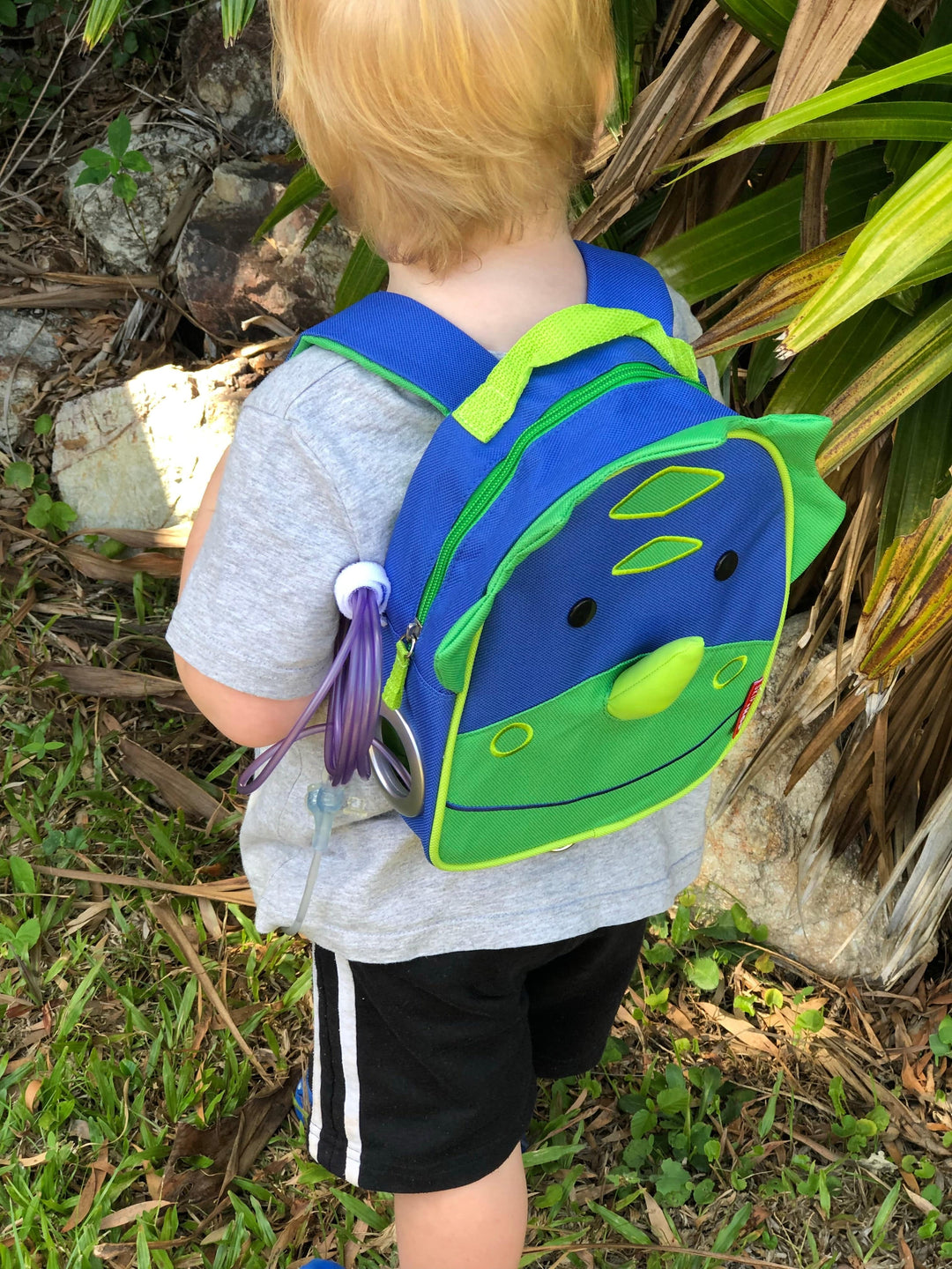 Tubie Fun Small Modified Backpack for nutrition, showing compact, colorful design with adjustable straps and multiple compartments.