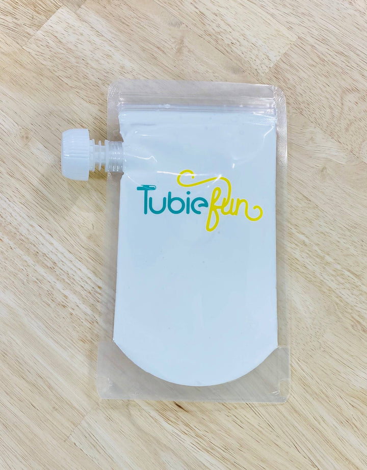 Reusable 500ml Tubie Fun Nutrition pouches with secure caps, ideal for storing and dispensing homemade or store-bought liquids.