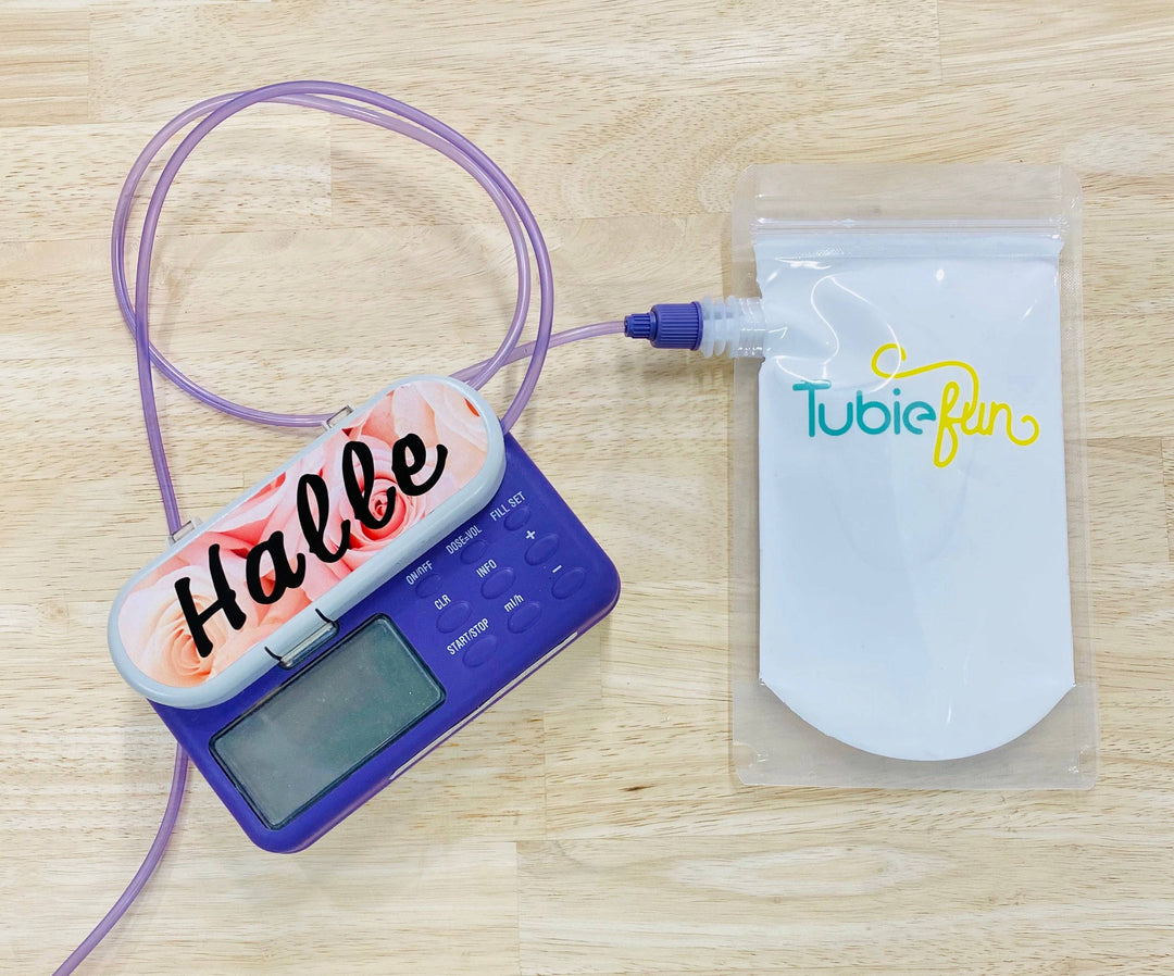Reusable Tubie Fun 500ml nutrition pouches with colorful caps, designed for easy feeding and storage of liquids or purees.