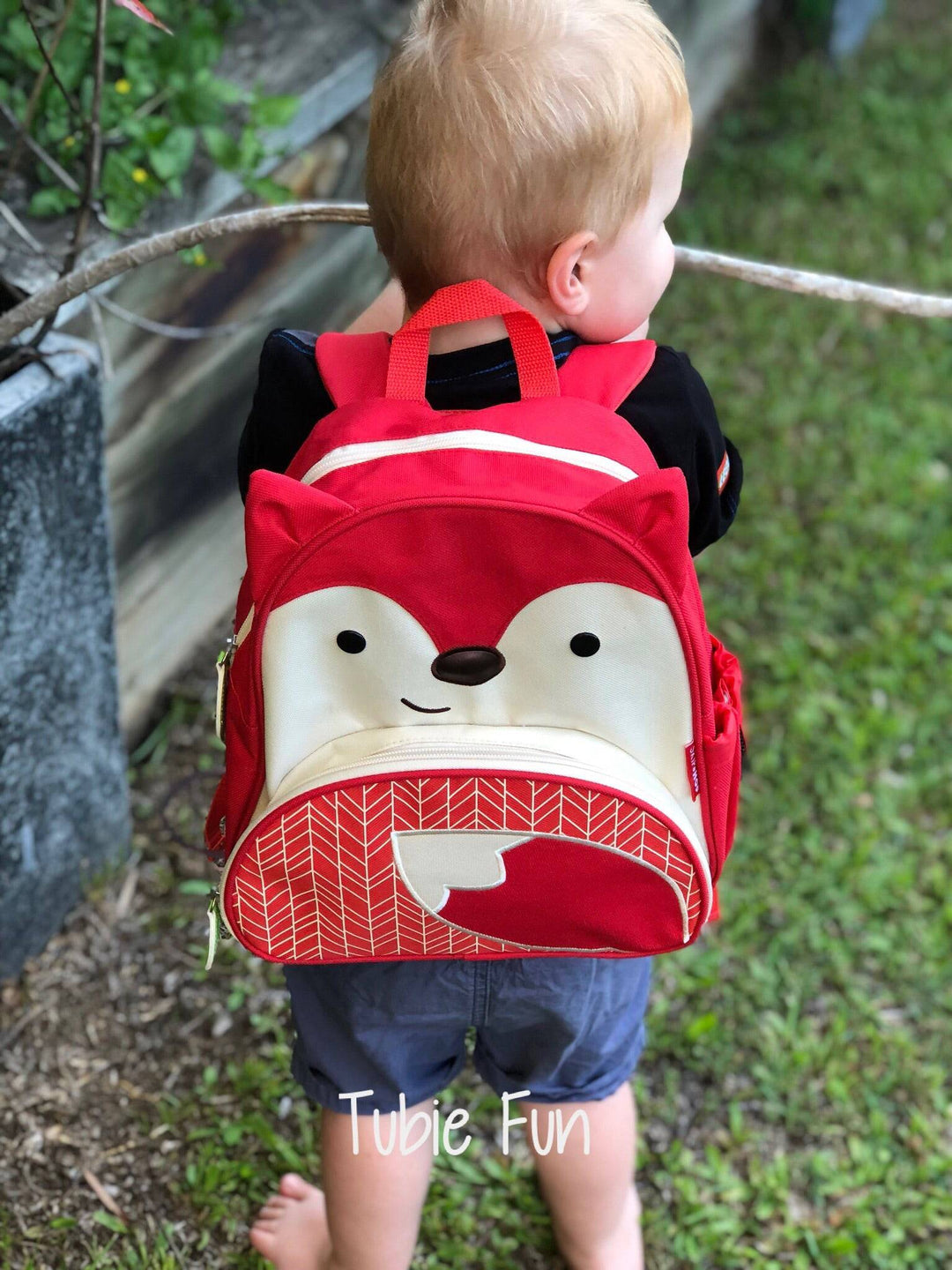 Tubie Fun Modified Backpack for nutrition, showing the colorful, adjustable medical backpack with tubing ports and storage compartments.