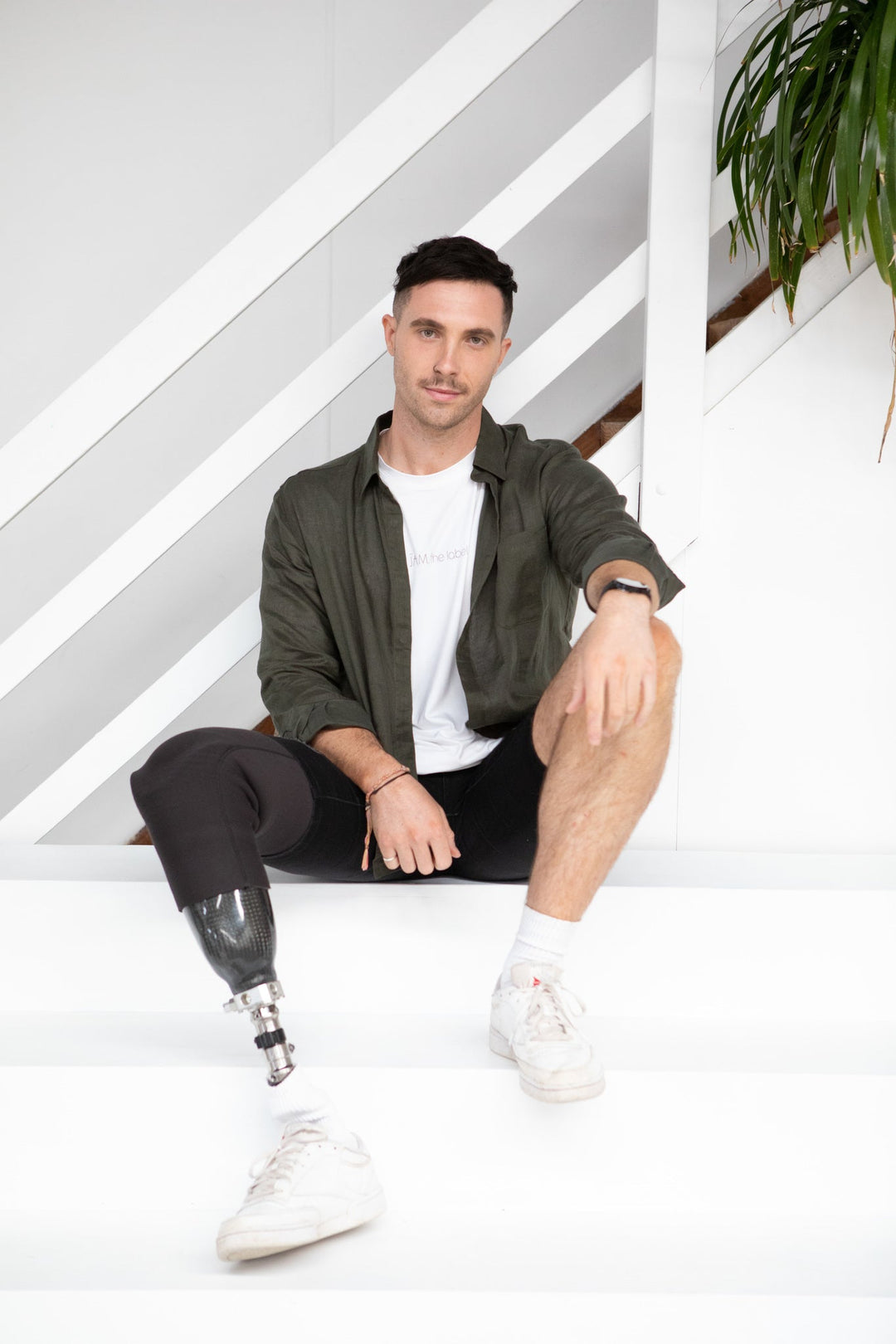 JAM the Label long sleeve crew shirt in white, featuring a relaxed fit and soft fabric, displayed on a hanger.