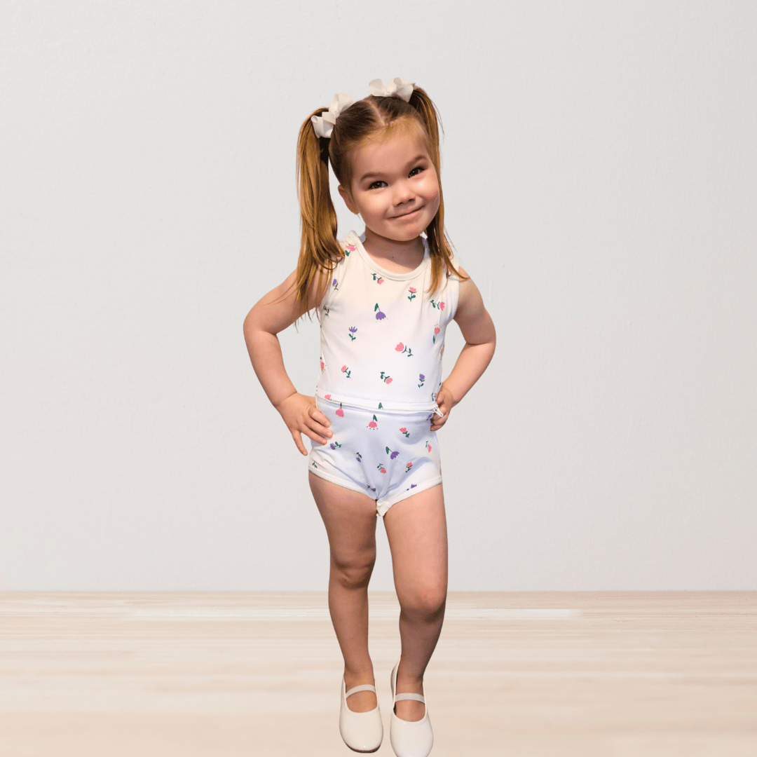 Kids' RareWear OneEase Signature Bodysuit in floral design featuring soft fabric and comfortable fit for everyday wear.