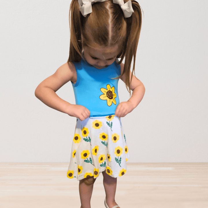 RareWear OneEase adaptive dress for kids featuring a floral pattern, soft fabric, and comfortable fit.
