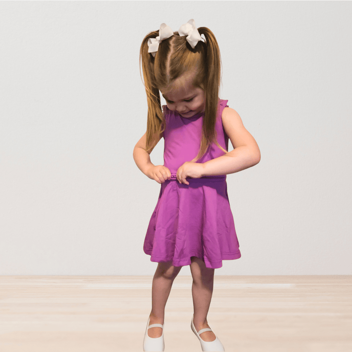 RareWear OneEase adaptive dress for kids, featuring a purple design, comfortable clothing perfect for children with special needs.