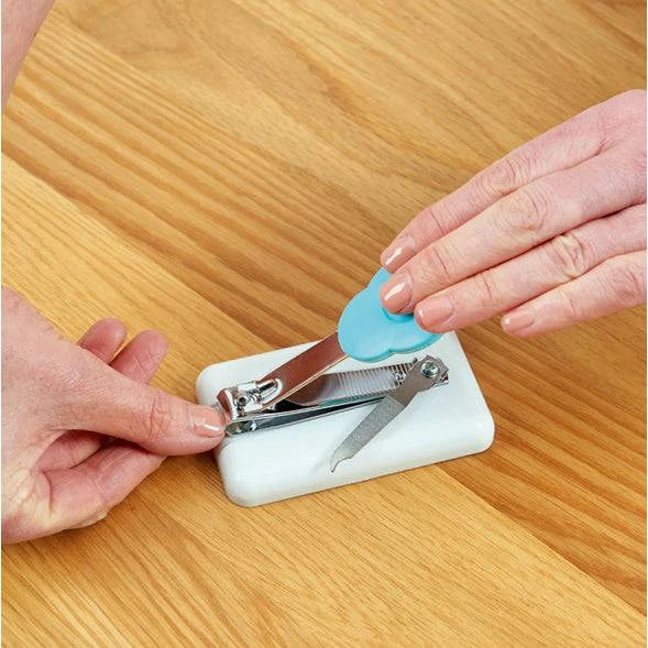 Performance Health Easi-Grip Table Top Nail Clipper in use, showing ergonomic design for easy nail trimming.
