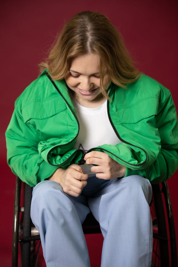 Close-up of JAM the Label Magnetic Zip Bomber Jacket showcasing zippers and fabric details.