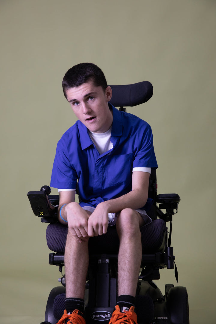 Cobalt short sleeve shirt by JAM the Label, featuring a modern fit and magnetic closure, displayed from a seated front view.