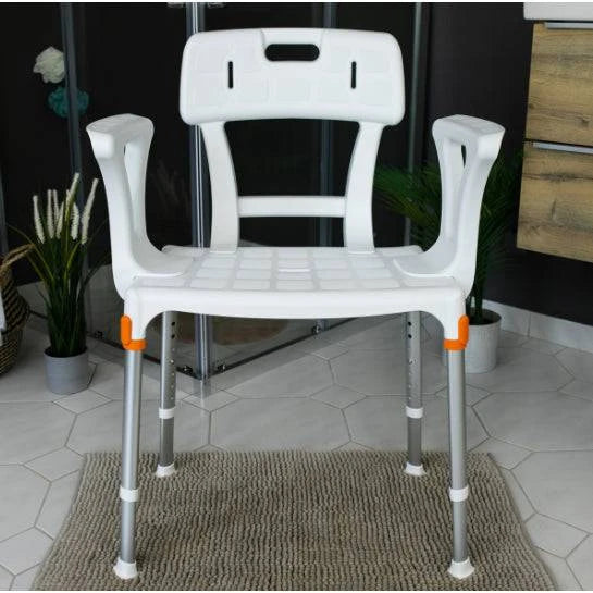 White King Shower Seat with back and armrests in a bathroom setting, designed for mobility support by Performance Health.